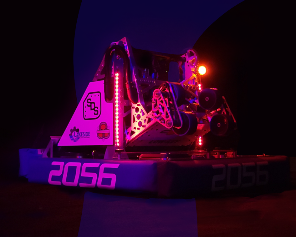 Team 2056 competition robot illuminated in magenta and blue